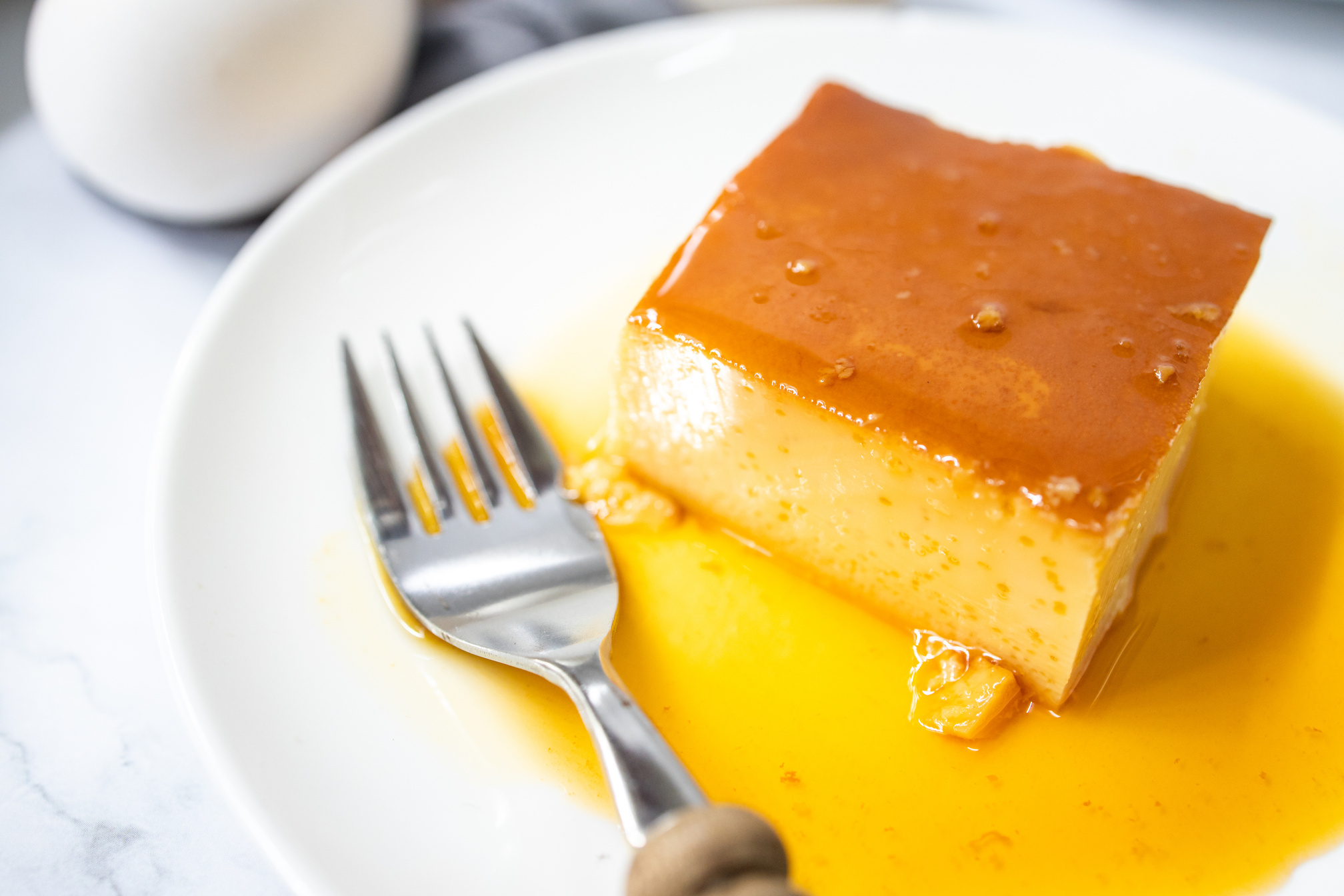 Slice of Sweet Leche Flan on a Plate